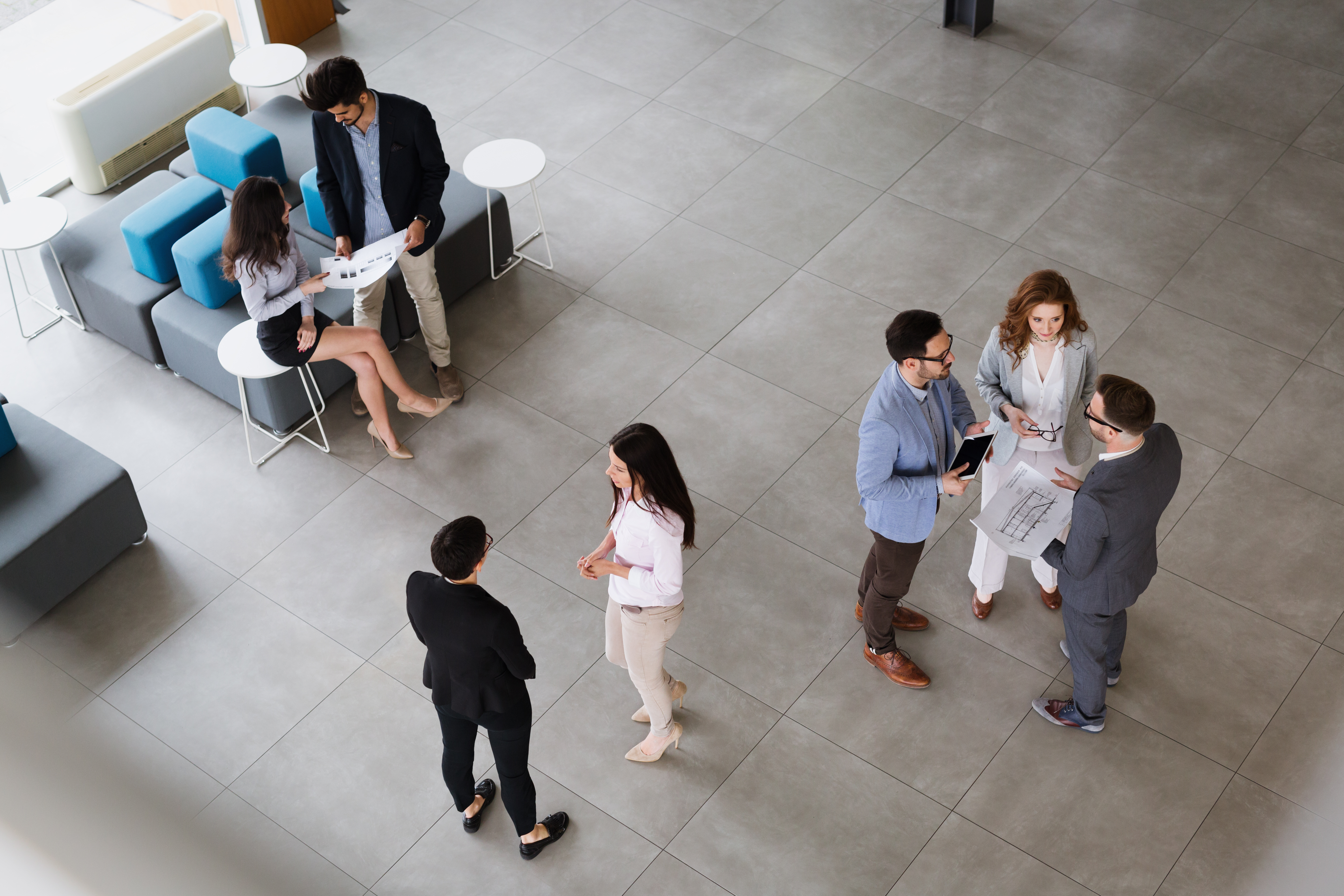 Top view of businesspeople in groups talking to each other